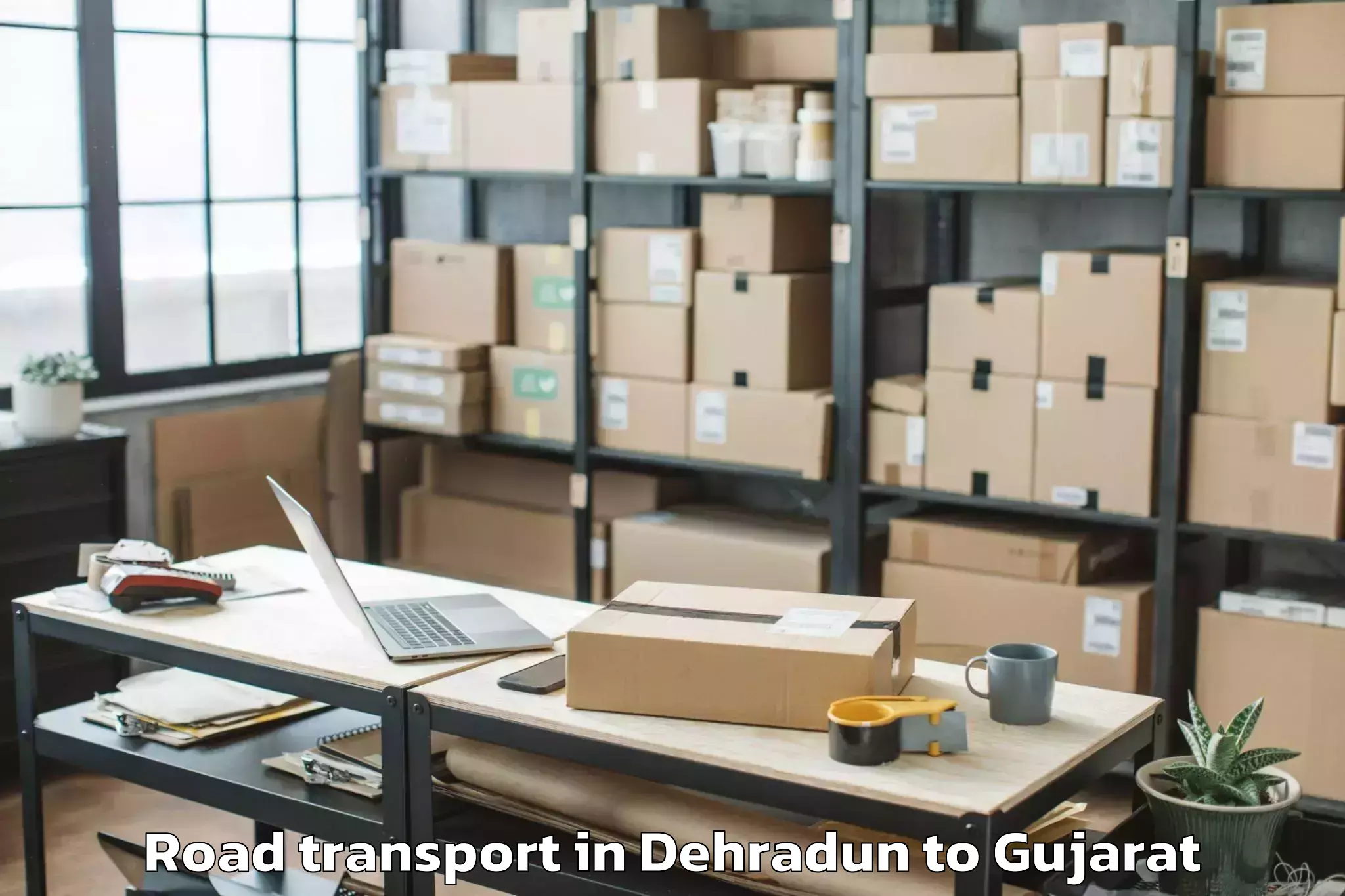 Book Dehradun to Dholka Road Transport Online